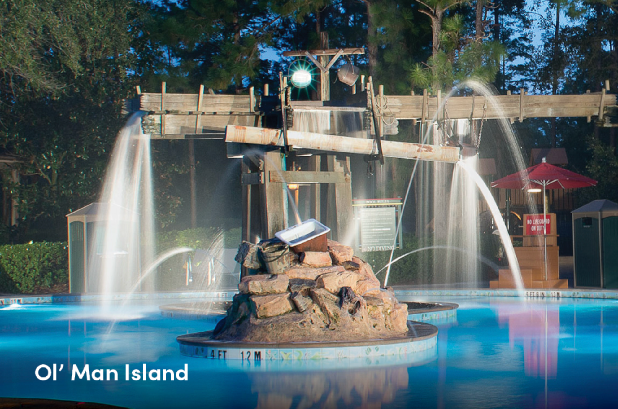 Scenic waterfront views of multiple resort pools and water features at sunset.
