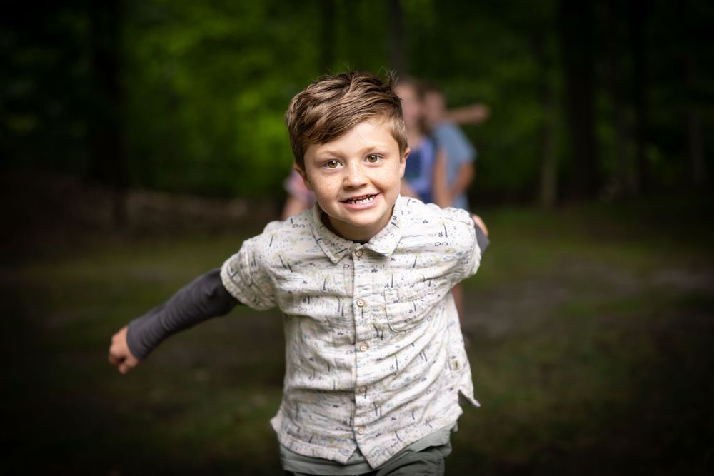 Person wearing a patterned white shirt shown in a sequence of expressive poses.