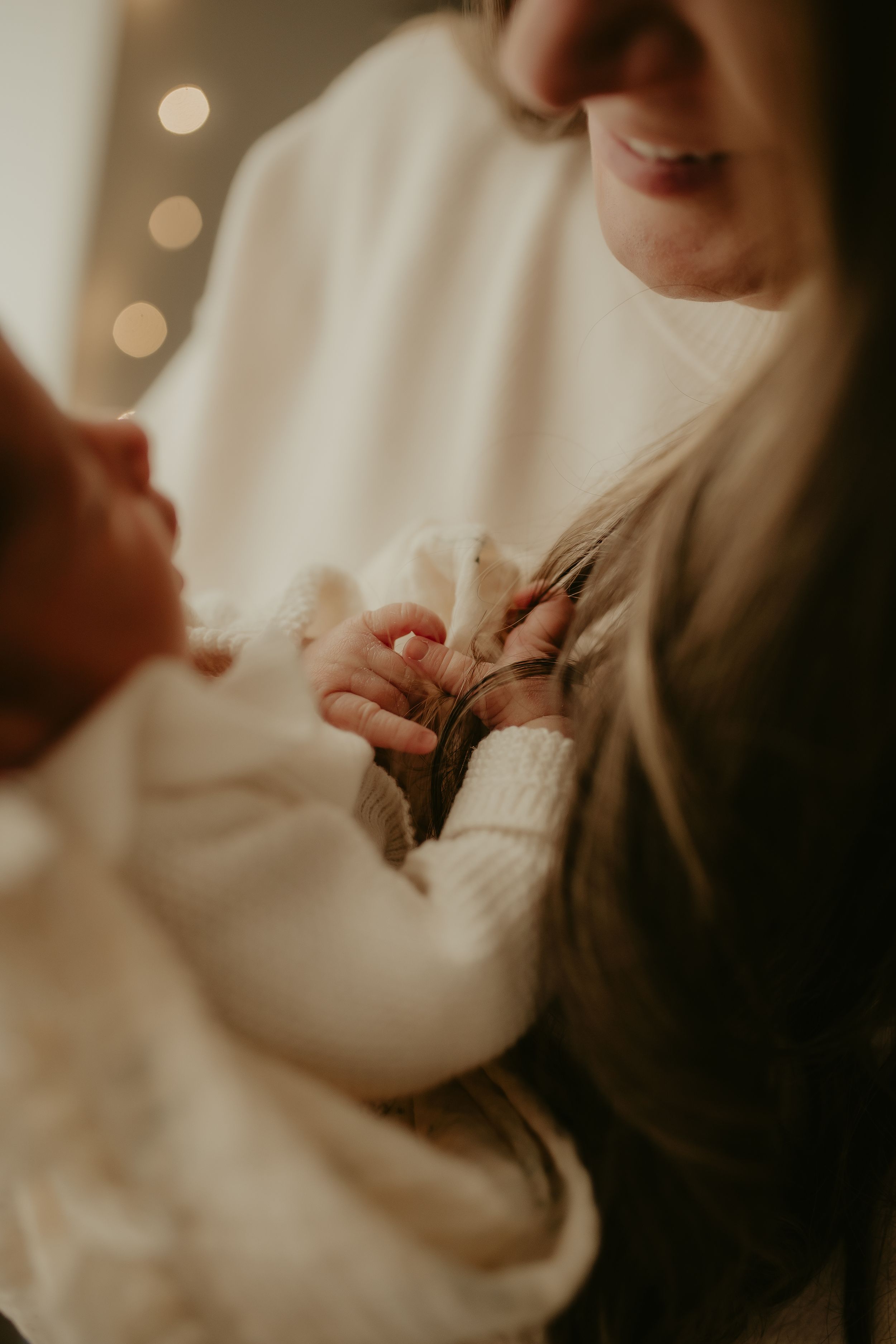 Close-up details of soft white knitted fabric in gentle lighting.