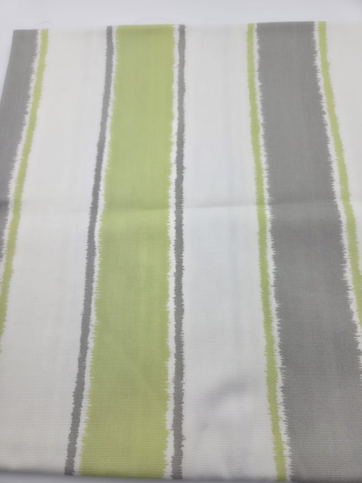 Vertical stripes in light green, gray and white creating a modern geometric pattern.