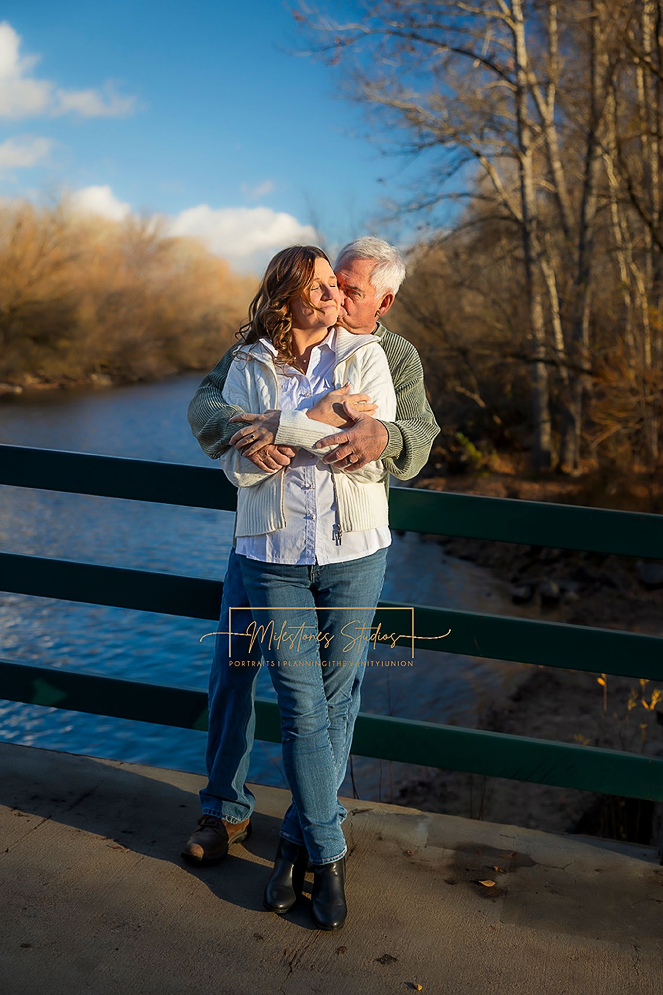 Couple on bridge over Boise River for Boise greenbelt engagement session