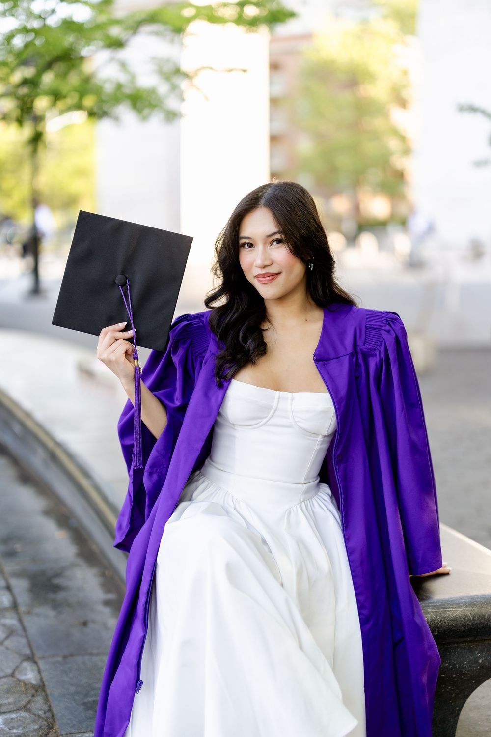 A person wearing a white dress and vibrant purple jacket poses outdoors in a series of connected photos.