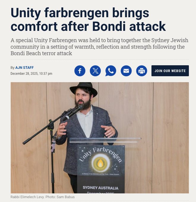 A speaker stands at a podium during a Unity Farbrengen community gathering event in Sydney Australia.