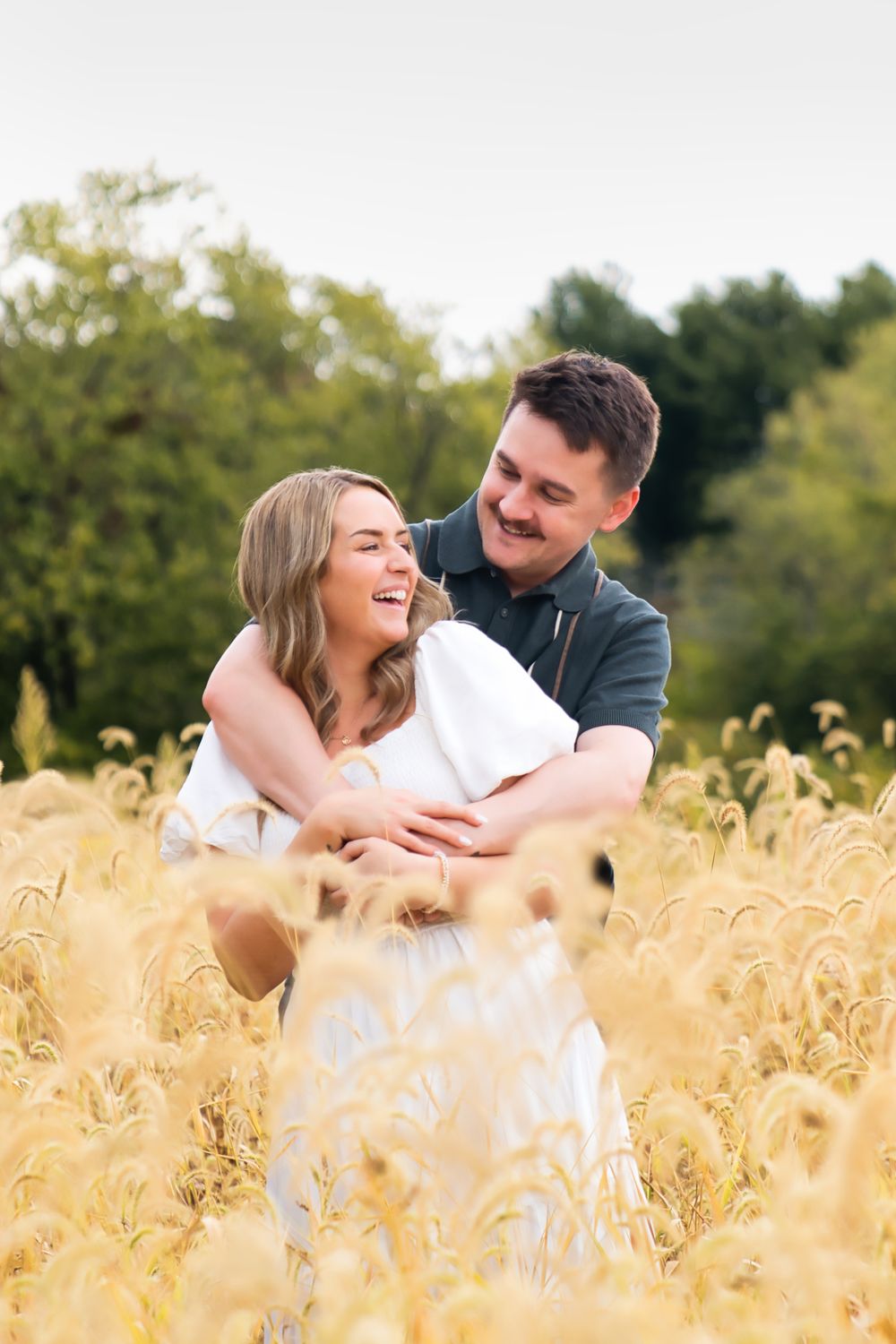 Best engagement locations for couples in Cincinnati. Couple laughing together at Historic White Oak Farm: Cincinnati Wedding Photographer