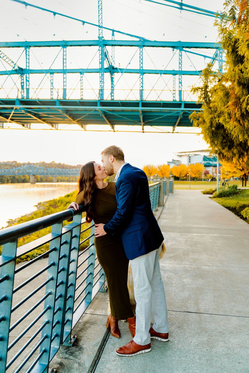 Downtown engagement locations for couples at downtown Cincinnati. Couple kissing at Smale Park: Cincinnati Wedding Photographer