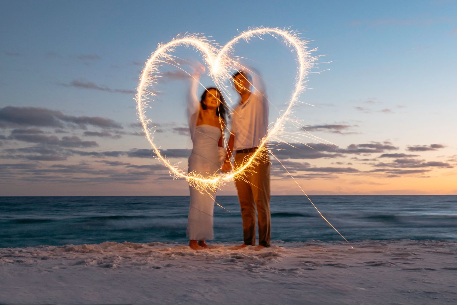 Fort Walton Beach Enagagement photographer captures creative photos at the beach during sunset. MJ Photography
