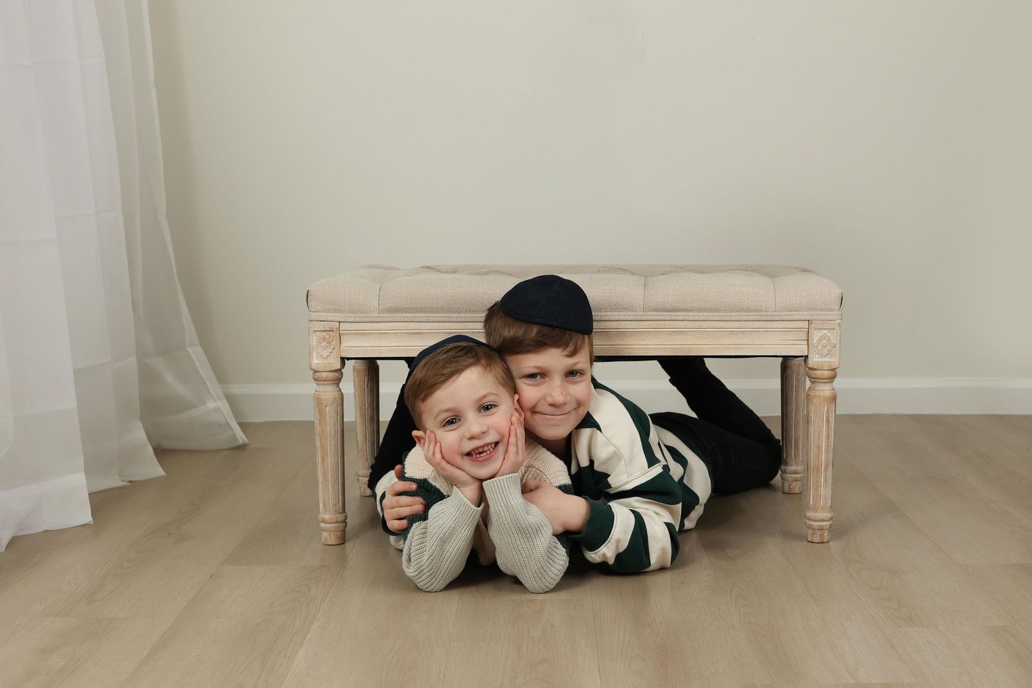portrait of brothers hugging taken at Gitty Strauss Photography Lakewood, NJ studio