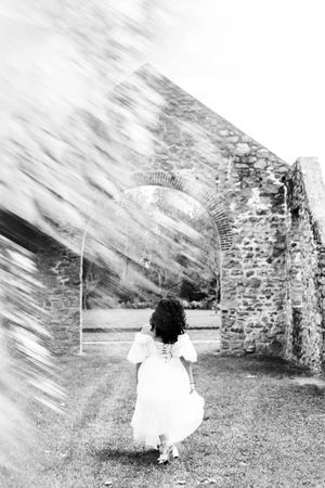 Artistic black and white photo of stone ruins with dramatic blurred motion effects.