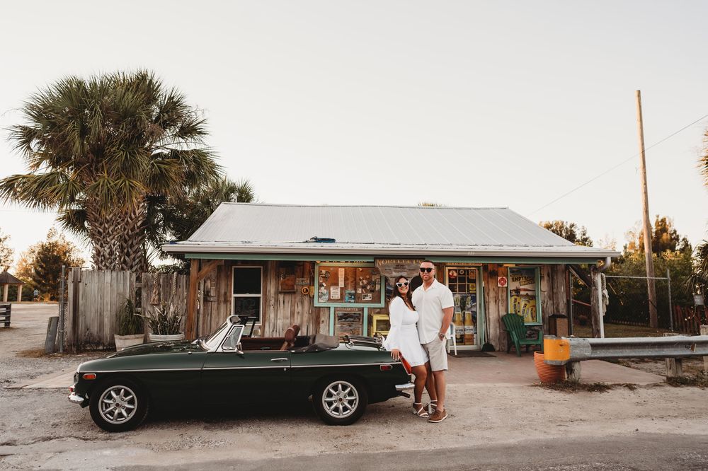 Classic Hernando County engagement session featuring a vintage car and historic bridge