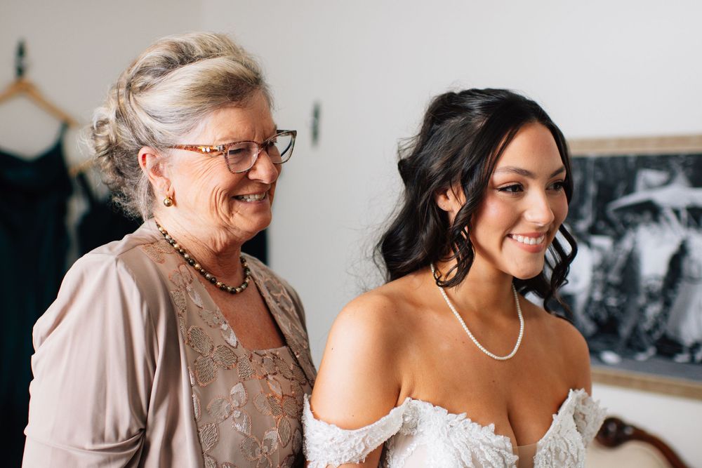 Intimate pre-wedding moments shared between bride and family member in neutral tones.