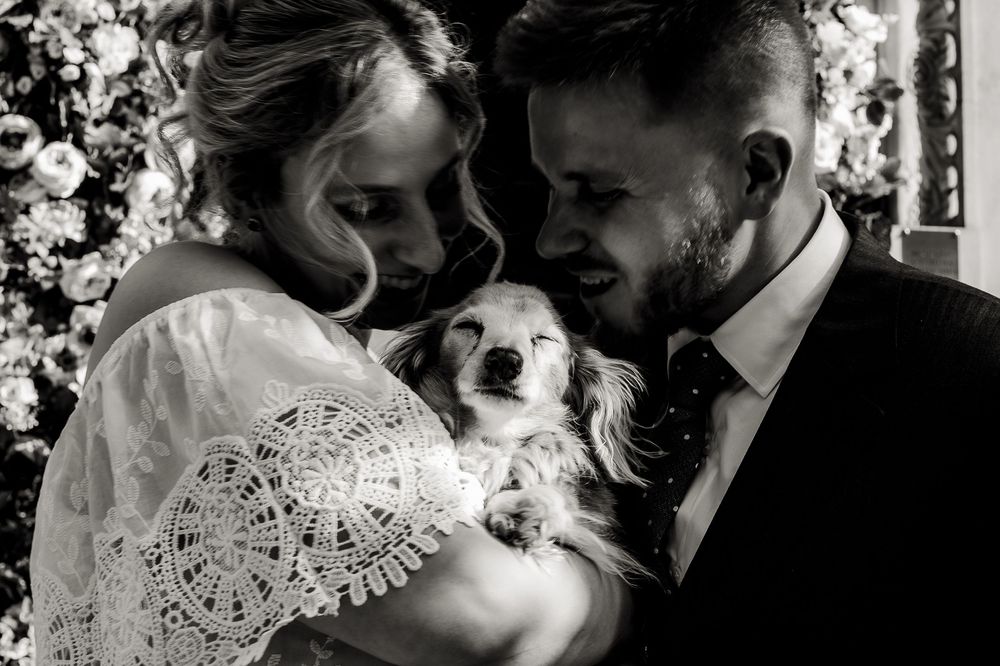 A romantic black and white wedding photo montage showing intimate moments between a couple.