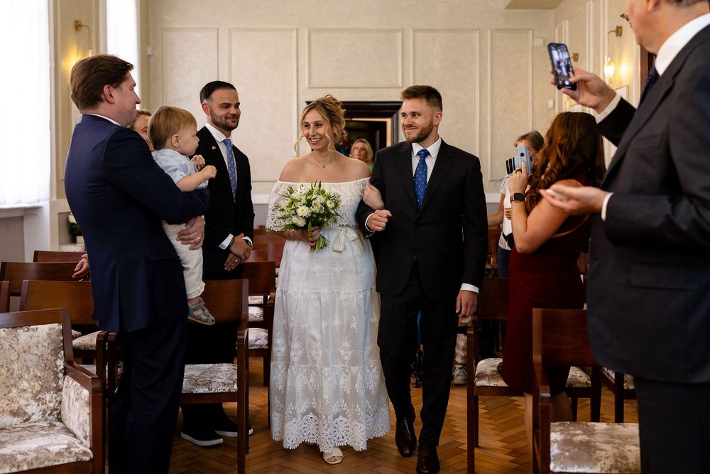 A sequence of candid wedding moments showing guests and wedding party members interacting at a formal celebration.