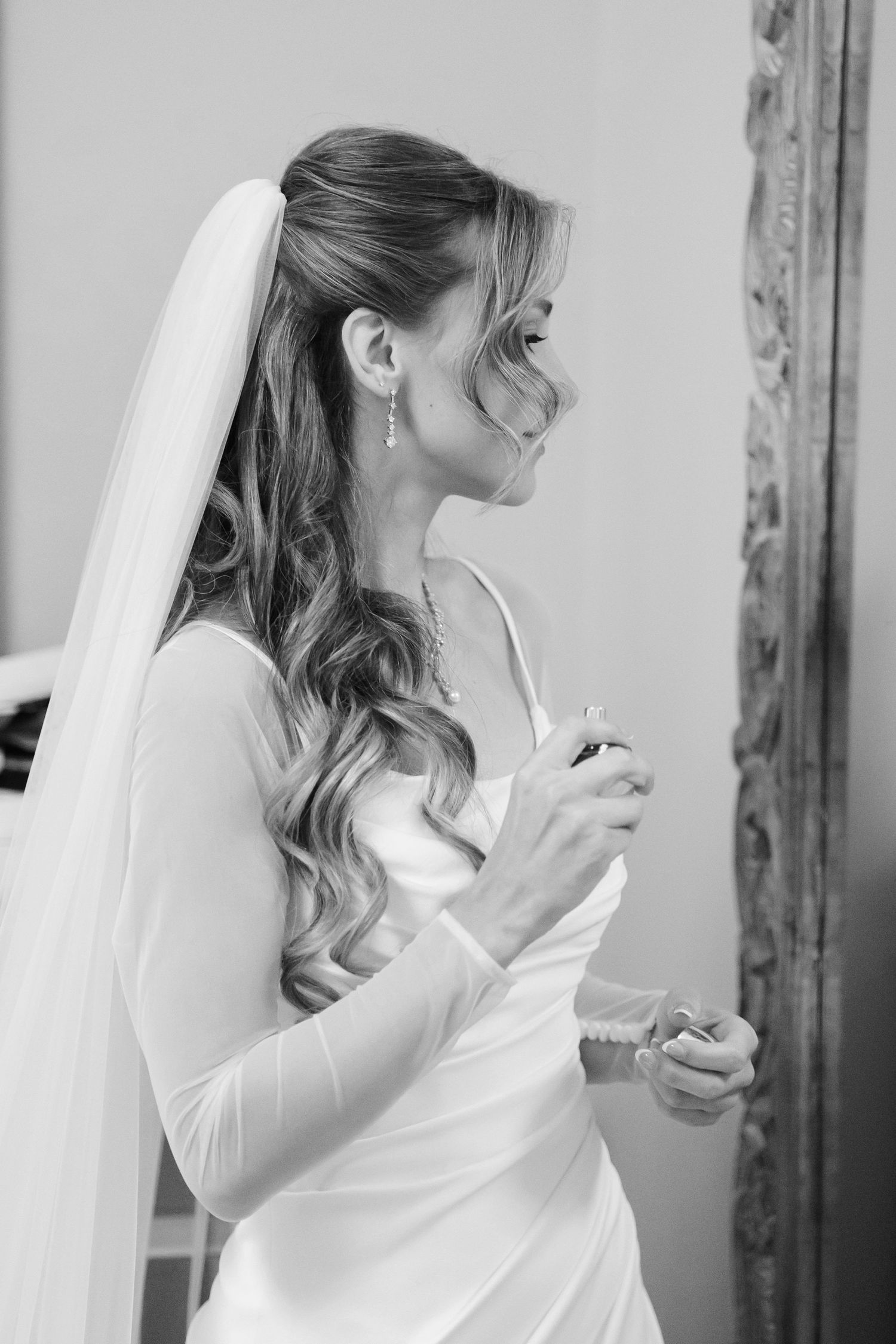 Bride spraying perfume captured by Tom Forrest Photography from Hudson, Ohio.