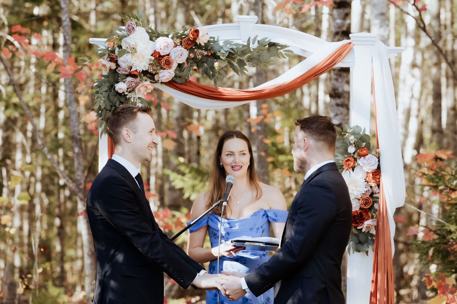 grooms holding hands during wedding ceremony, same sex wedding in New Brunswick, inclusive wedding photographer LGBTQ+ vendor Moncton
