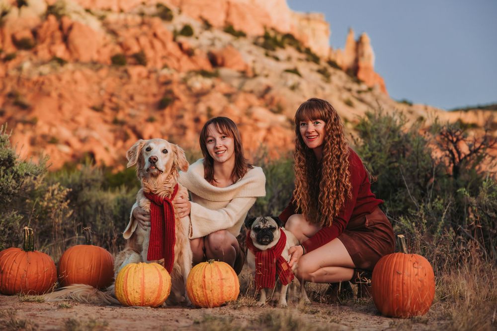 A series of fall family portraits with pumpkins and red rock formations in the background during golden hour.