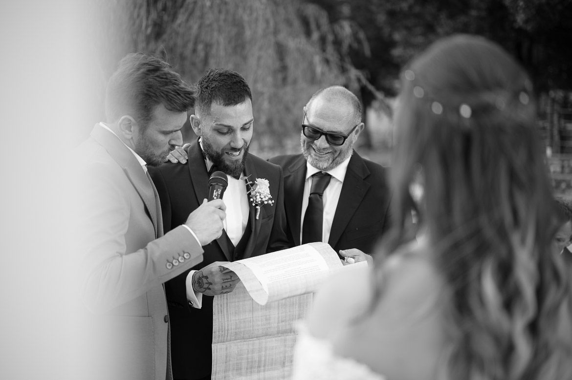 Black and white candid shots show emotional moments during a wedding ceremony.