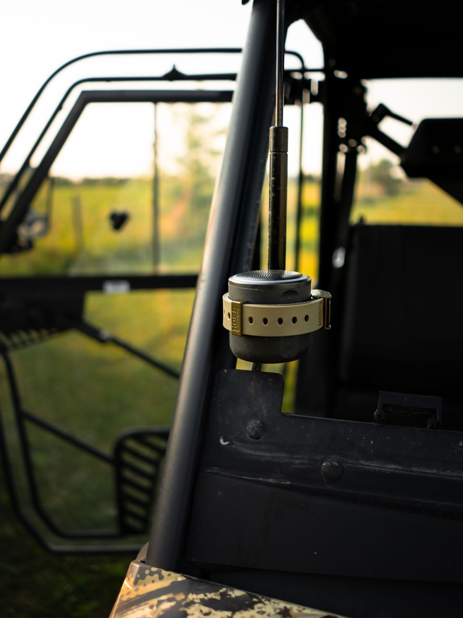 Interior view of camera equipment mounted inside a vehicle at sunset.