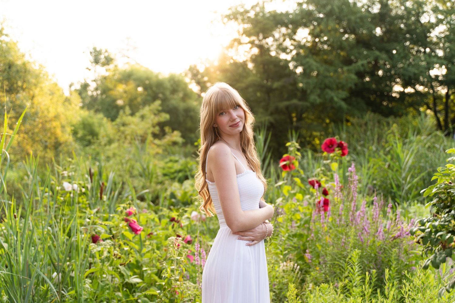 Perrysburg High School senior poses in field of flowers at Toledo Botanical Garden for her summer senior session.