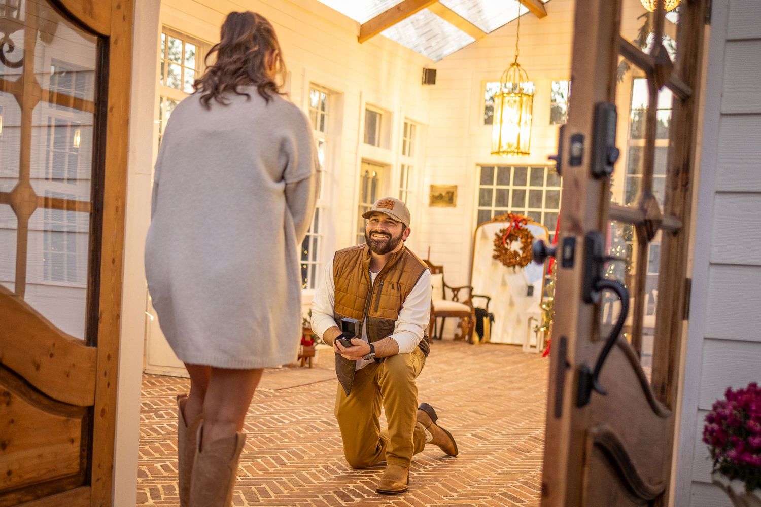 Man Proposing to girlfriend for Christmas at the English Cottage