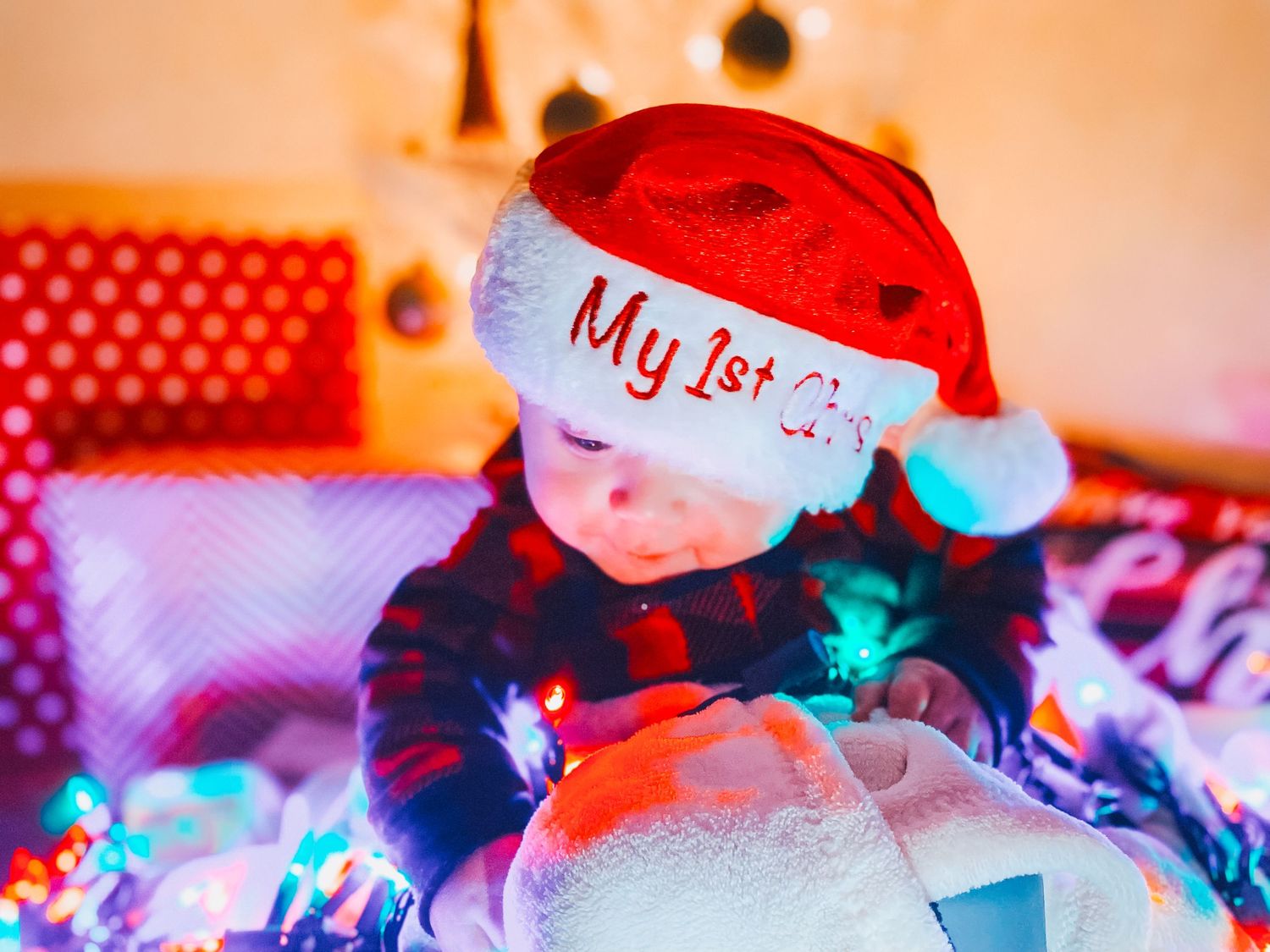 Holiday decorations and ultrasound photos in warm lighting.