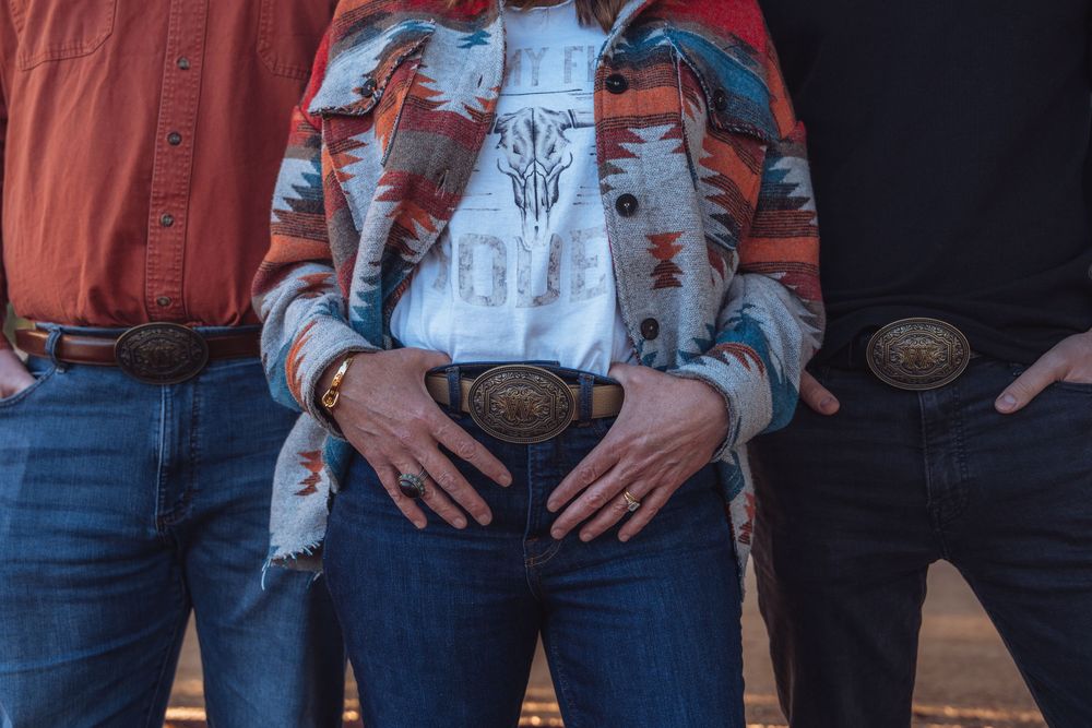 People in matching orange and denim outfits stand in a row showing coordinated casual style.