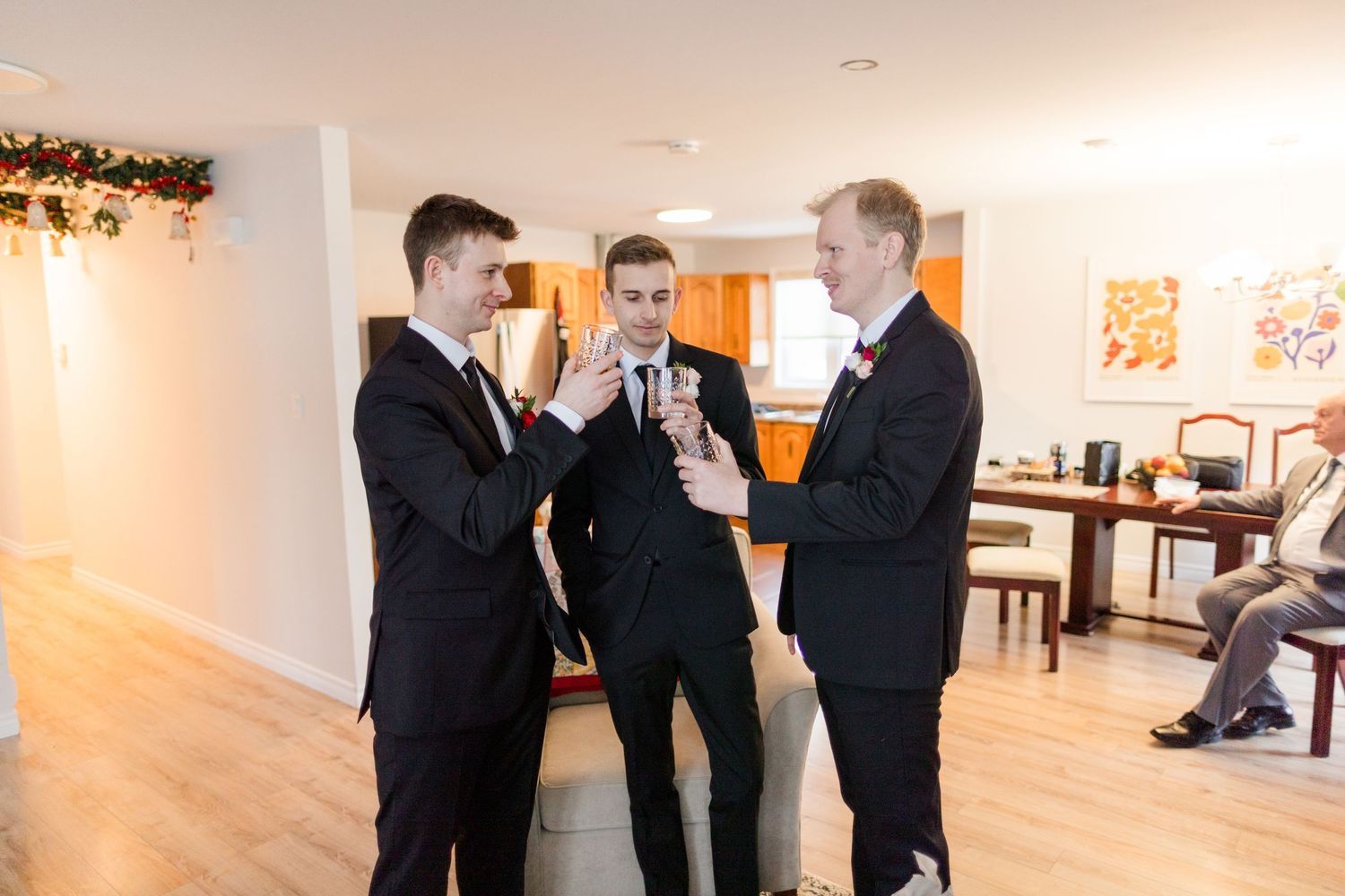 Business professionals gather in a bright gallery space during a networking event.