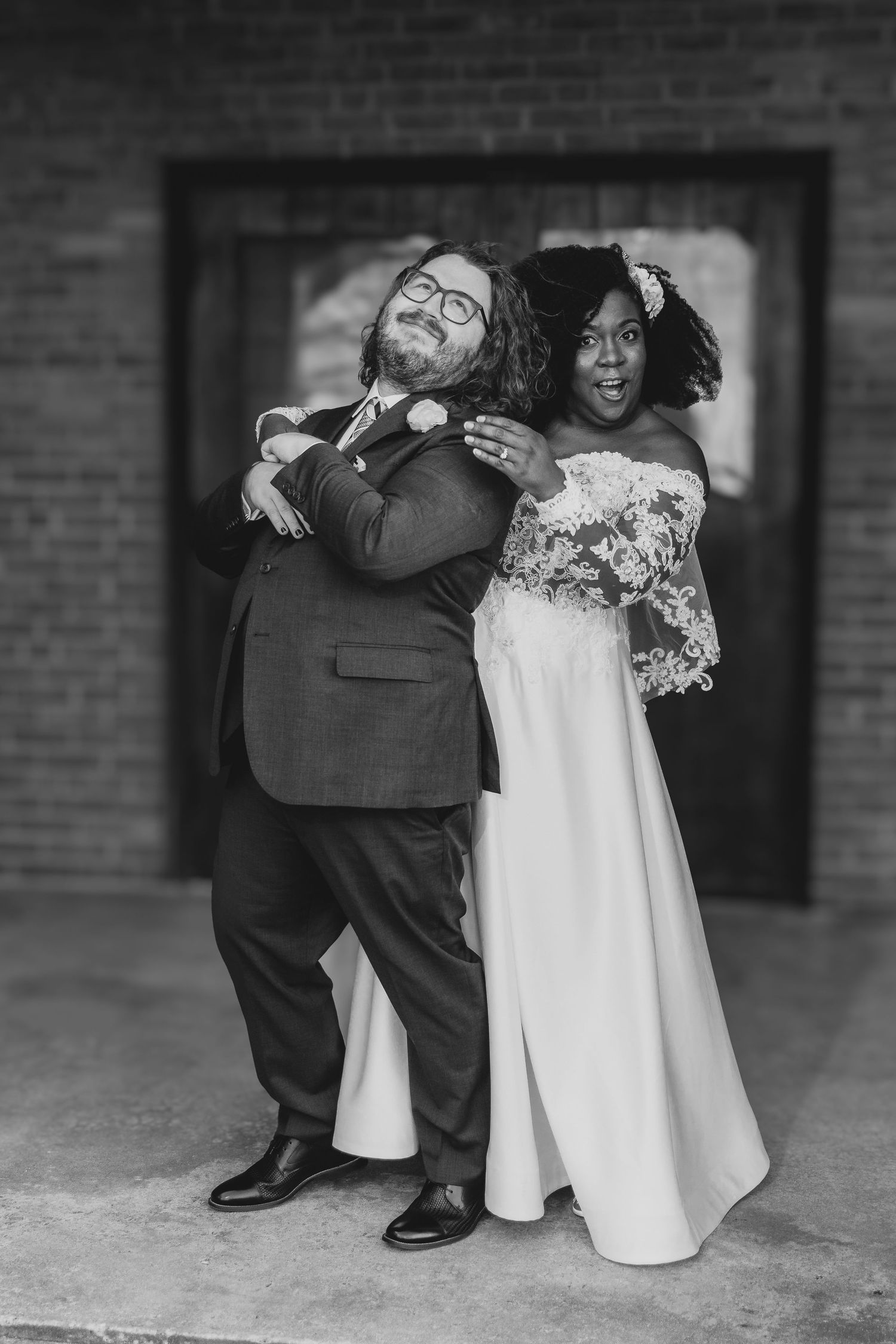 Black and white detail shots of wedding dress and formal shoes during intimate moments.
