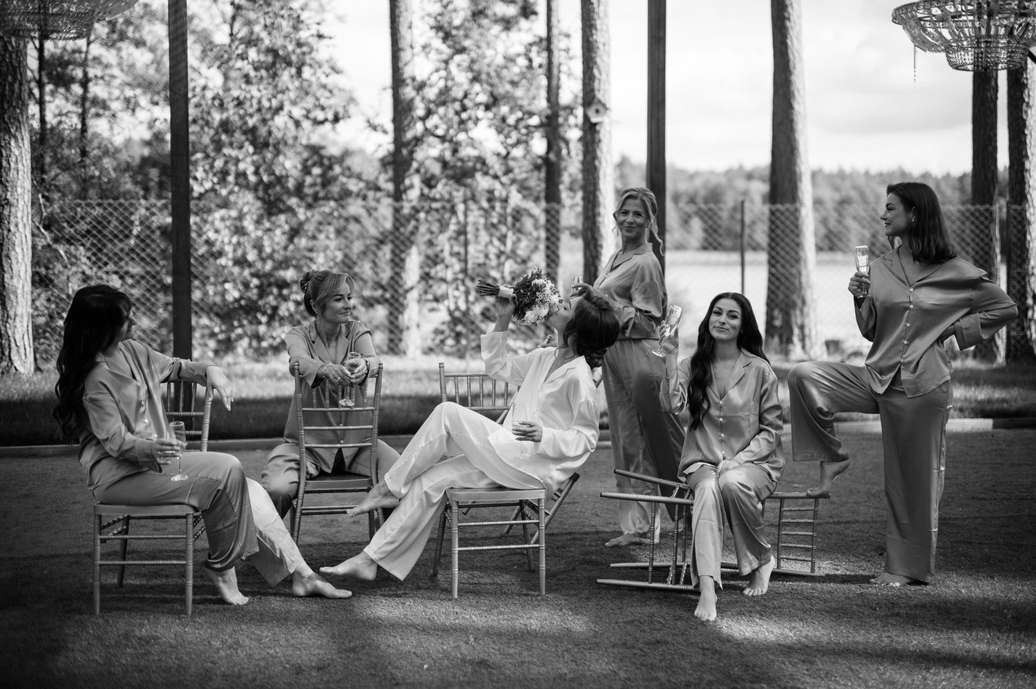 A black and white photo series showing people relaxing on porch chairs in a peaceful outdoor setting.
