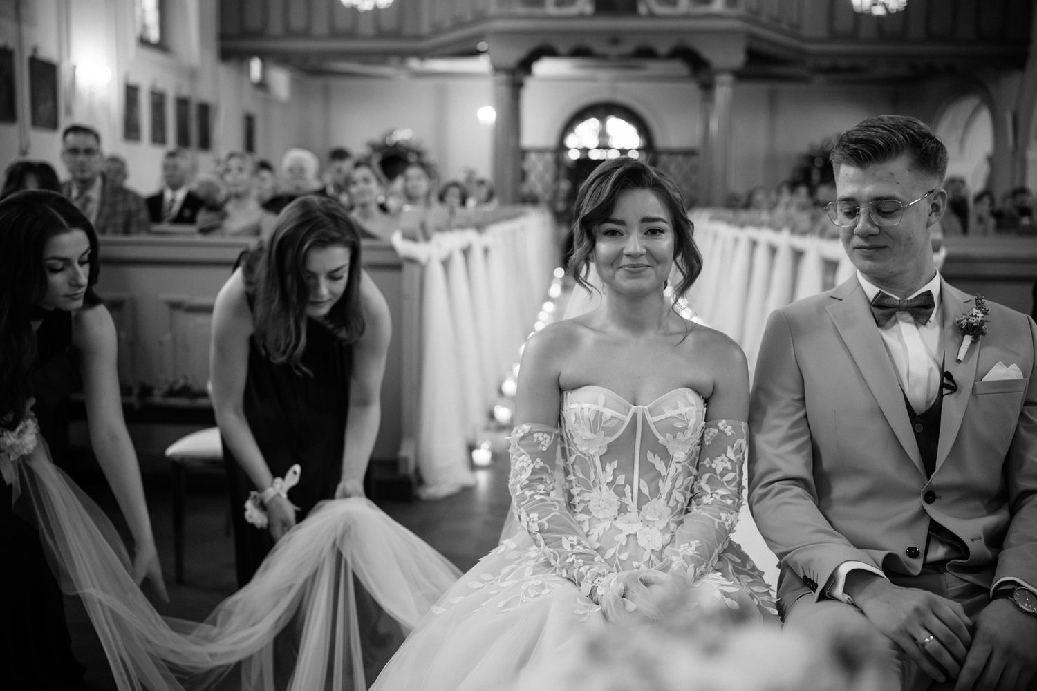 Black and white wedding reception photos show guests celebrating and dancing at an elegant venue.