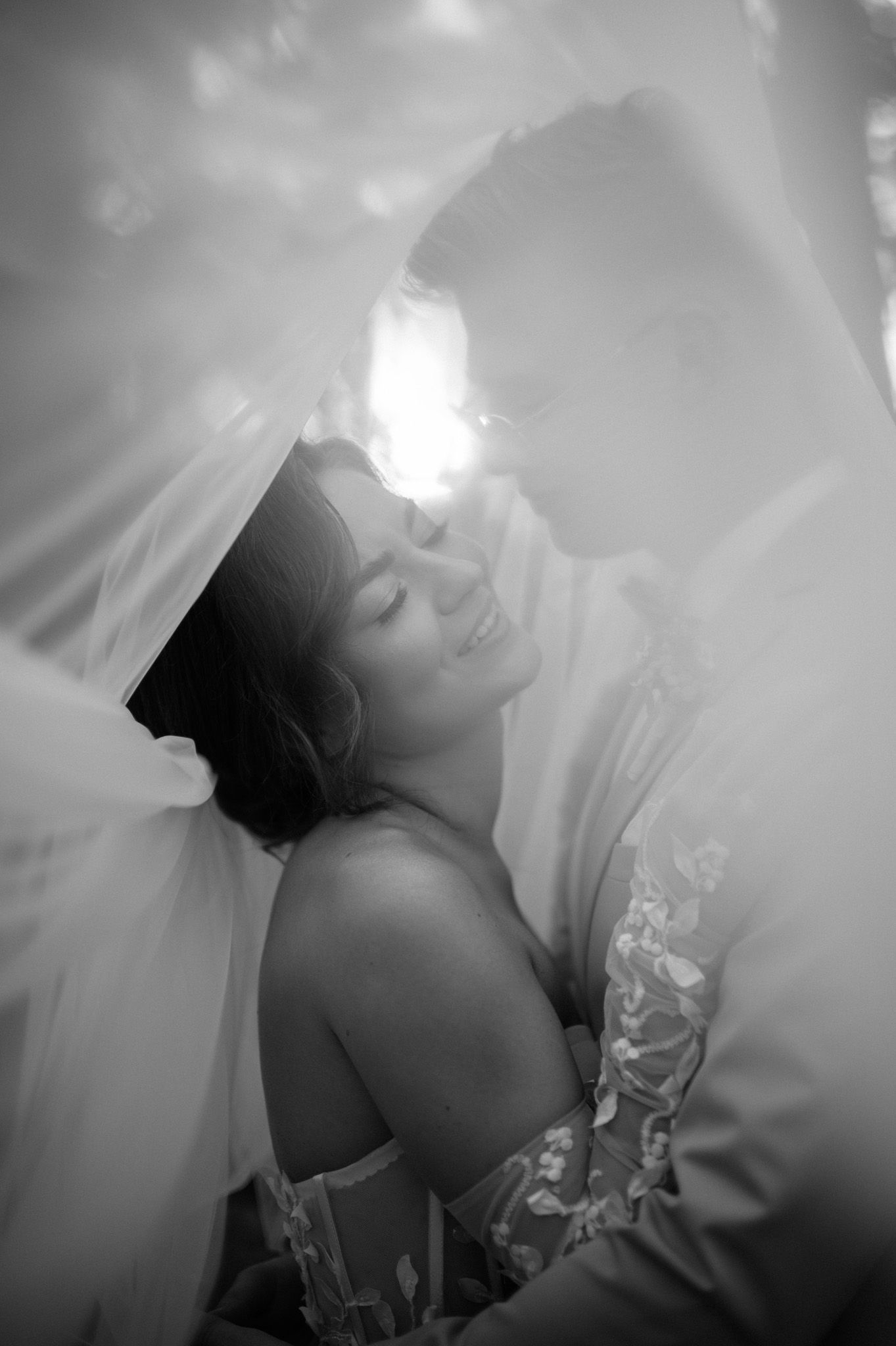 Ethereal black and white portrait series showing a figure in dramatic lighting with dreamy, soft-focus effects.