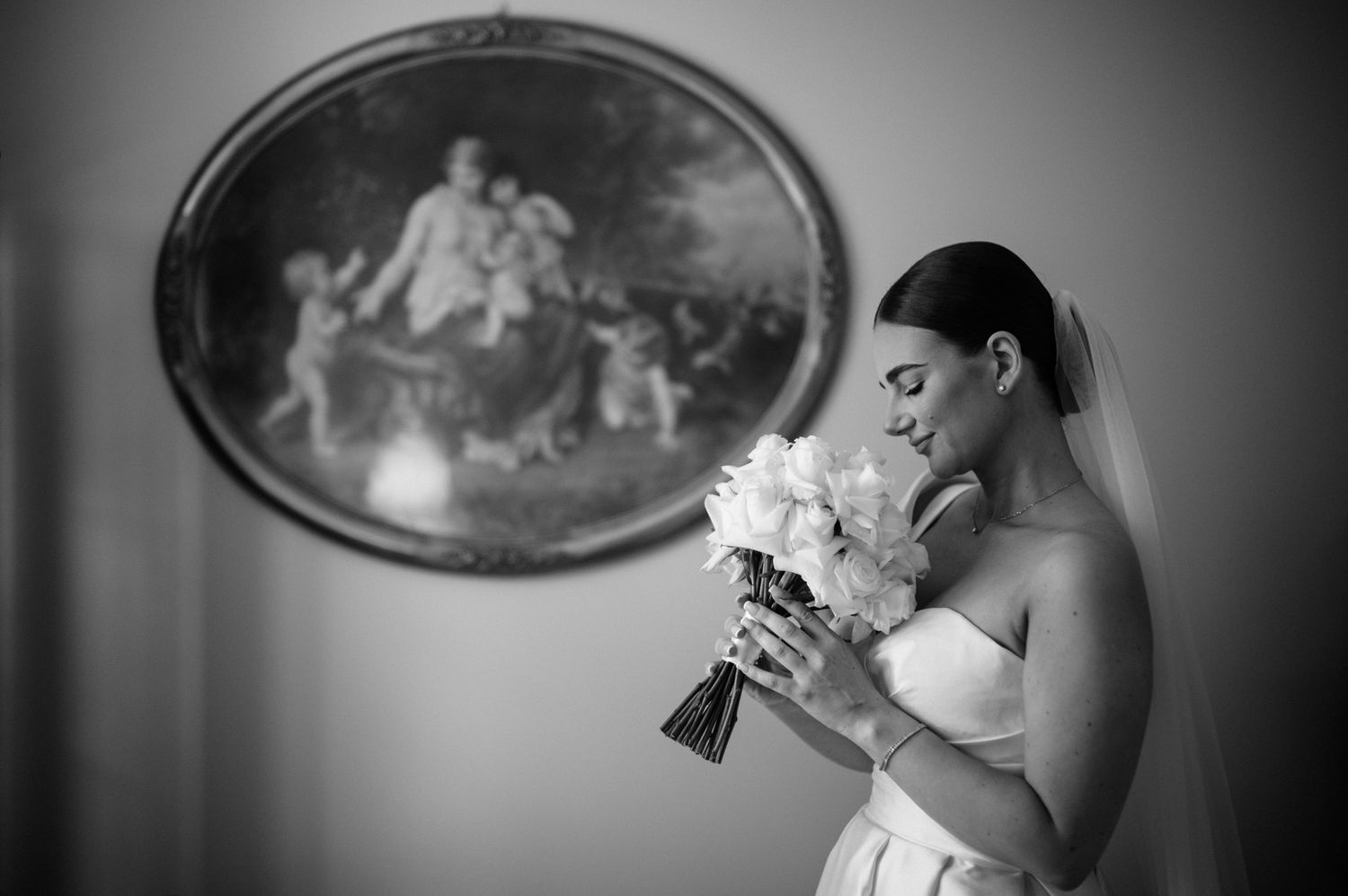 Black and white wedding photo series showing intimate moments between a couple during their special day.
