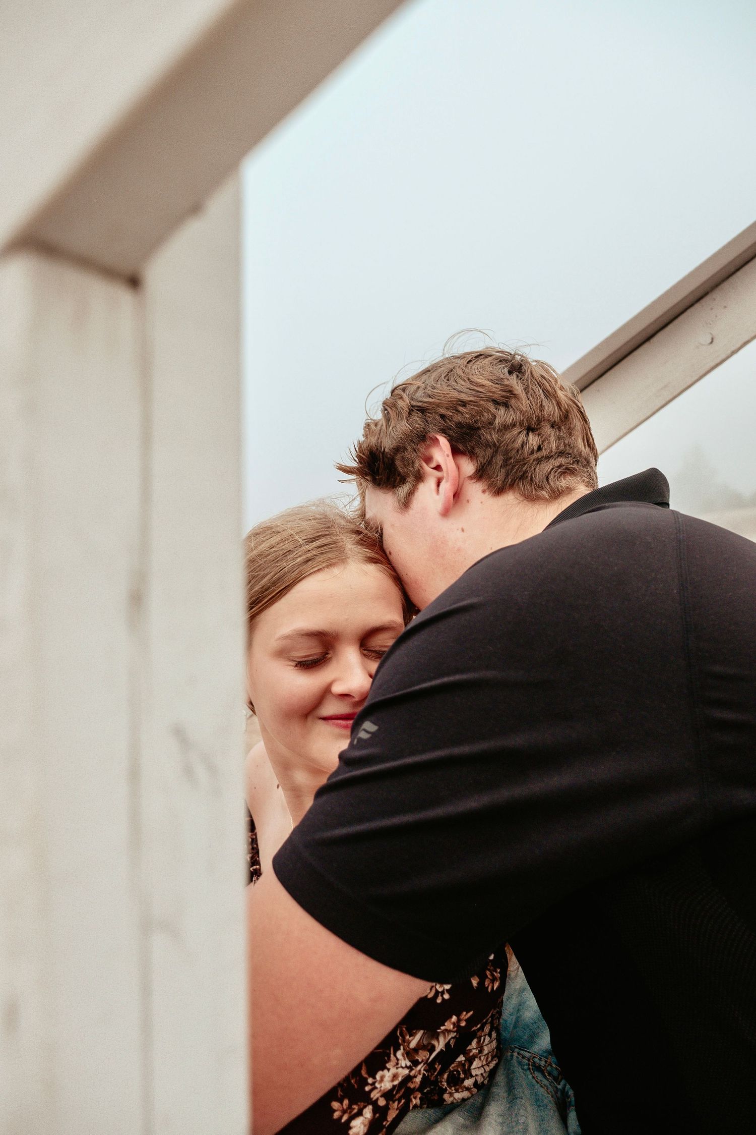 A romantic sequence of photos showing a tender kiss between two people against a white background.