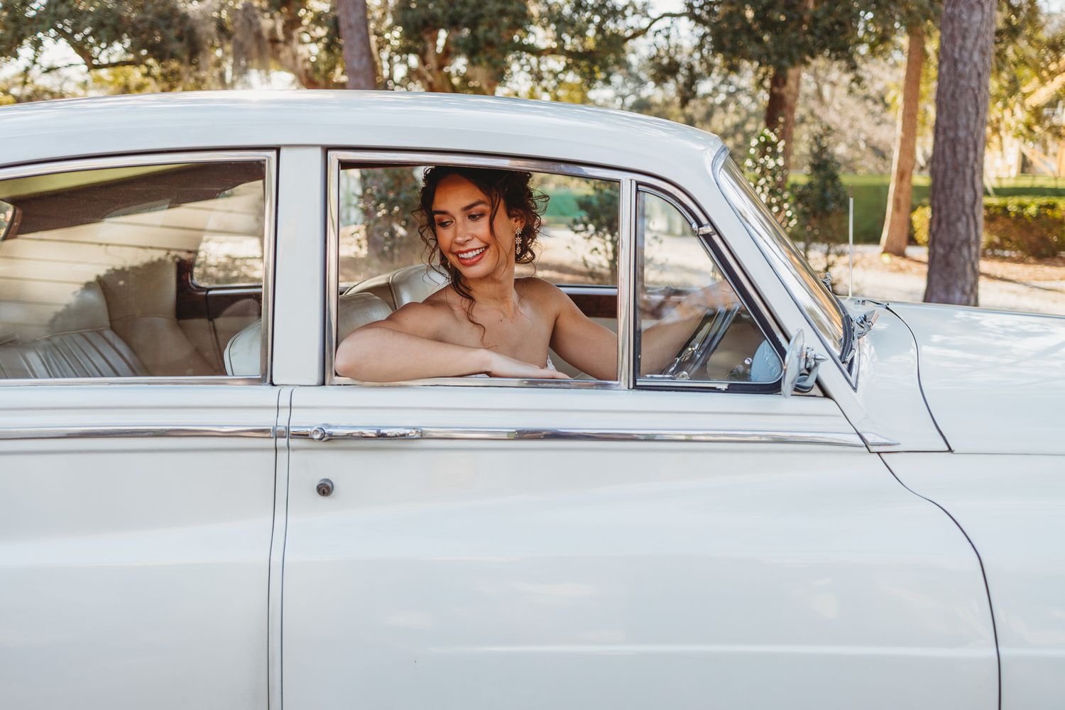 A series of romantic photos featuring a vintage white car during a couple's photoshoot.