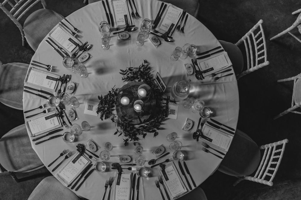 Overhead view of elegant wedding reception tables with floral centerpieces.