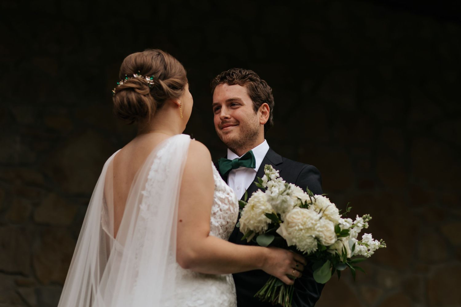 A couple shares intimate moments during their wedding photo session in a rustic indoor setting. Conner Prairie, Fishers Indiana