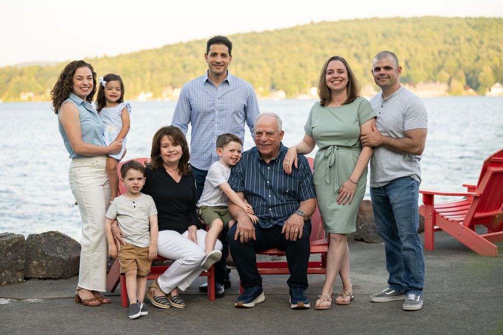 A series of outdoor family photos taken at sunset with matching outfits in shades of blue and white.