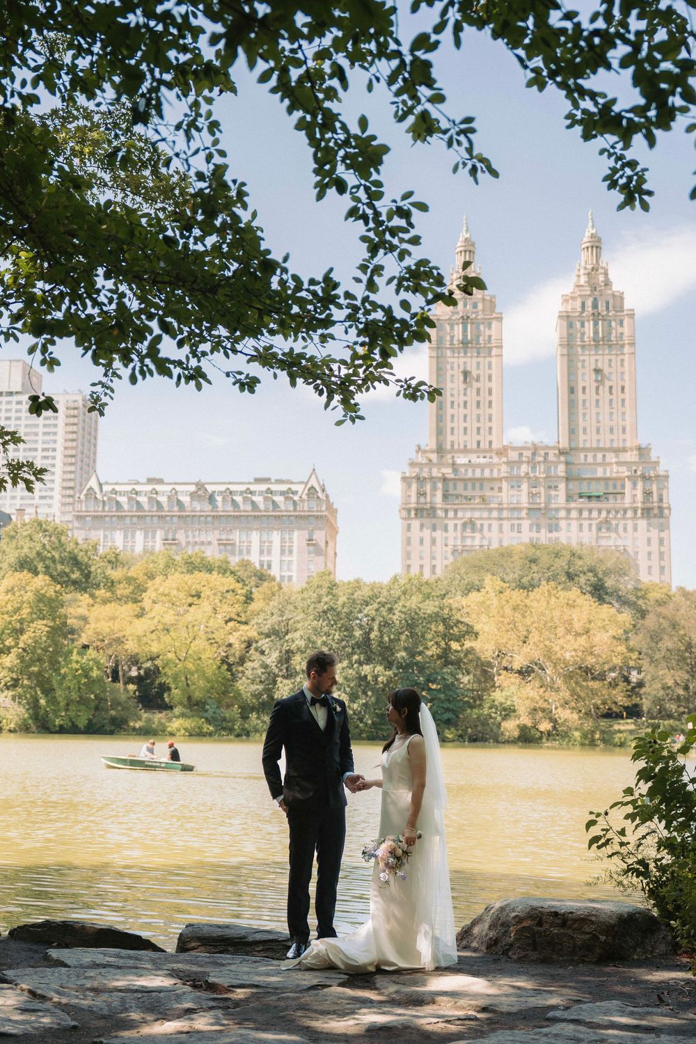 A couple admires the iconic San Remo towers from Central Park on their wedding day.