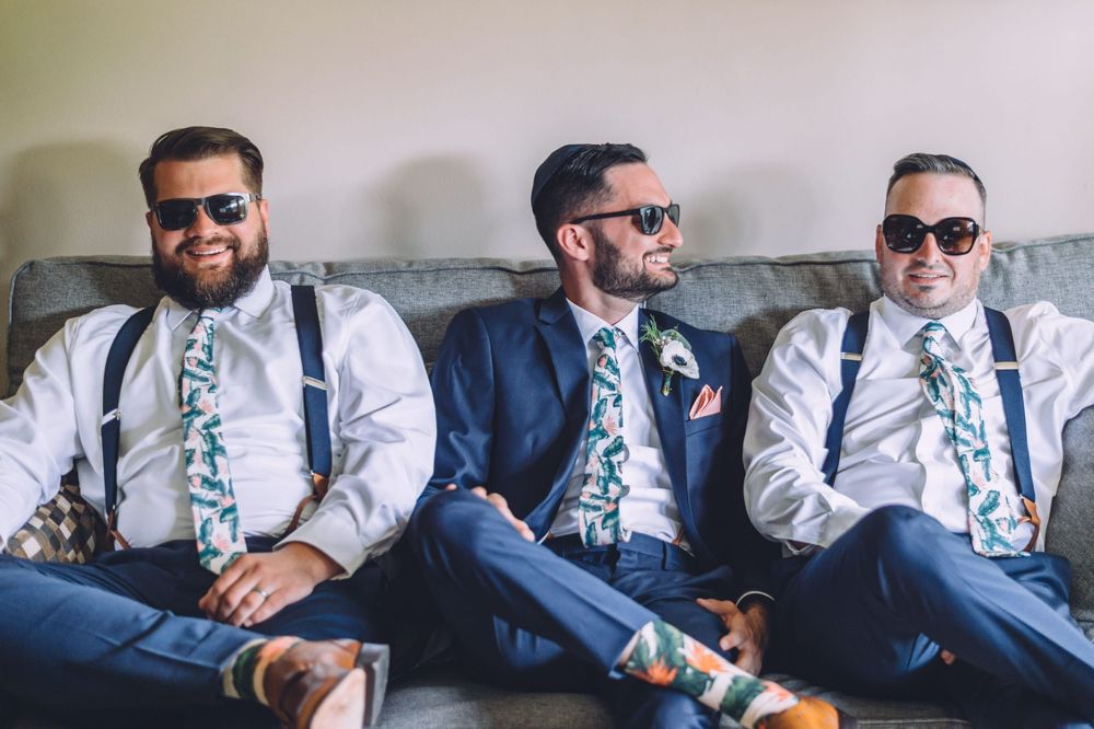 A sequence of photos showing people sitting on a couch and interacting while wearing business attire and sunglasses.