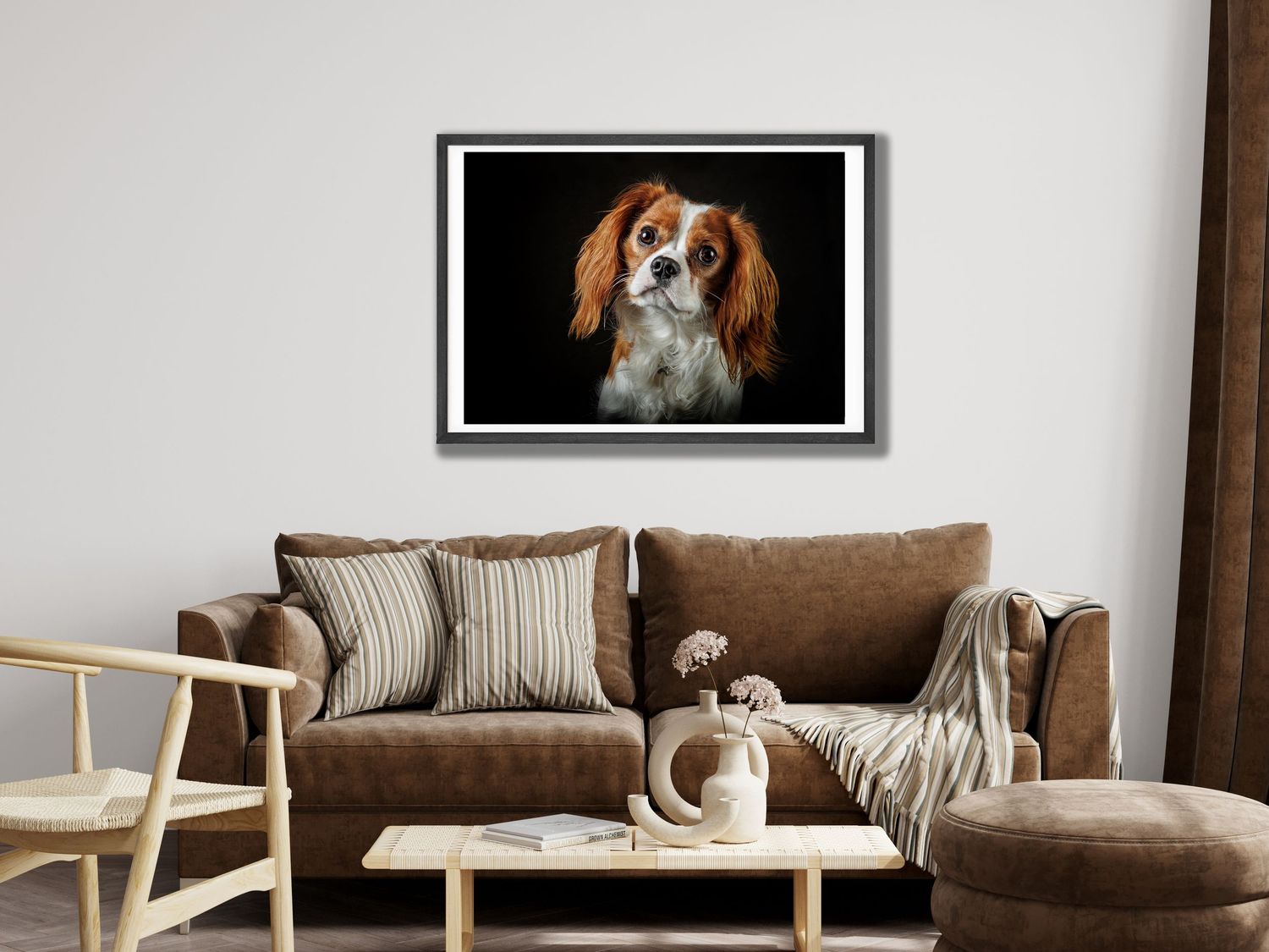 Modern living room interior with brown leather sofa, wooden furniture and framed dog portrait on wall.