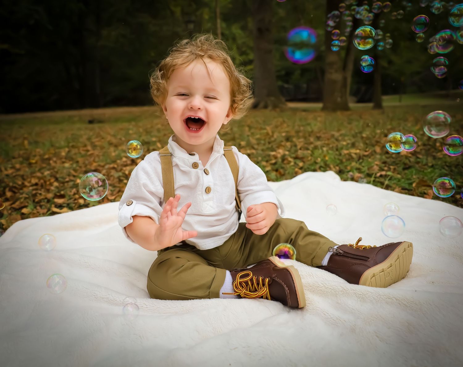 Playful scene with soap bubbles floating in an autumn setting against a white backdrop.
