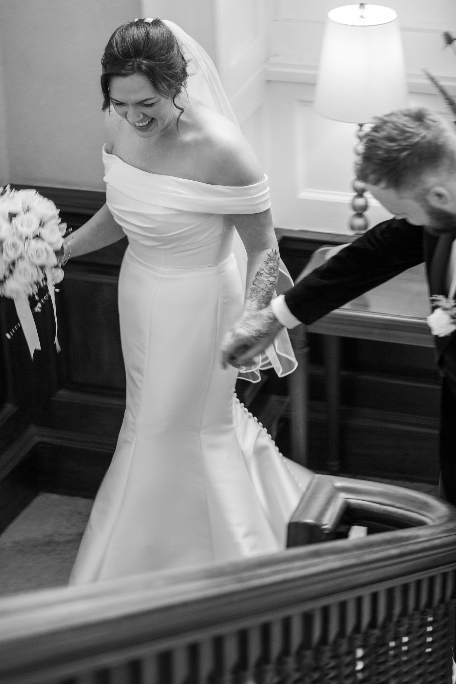 Bride and Groom walking down the stairs in Oxfordshire Wedding