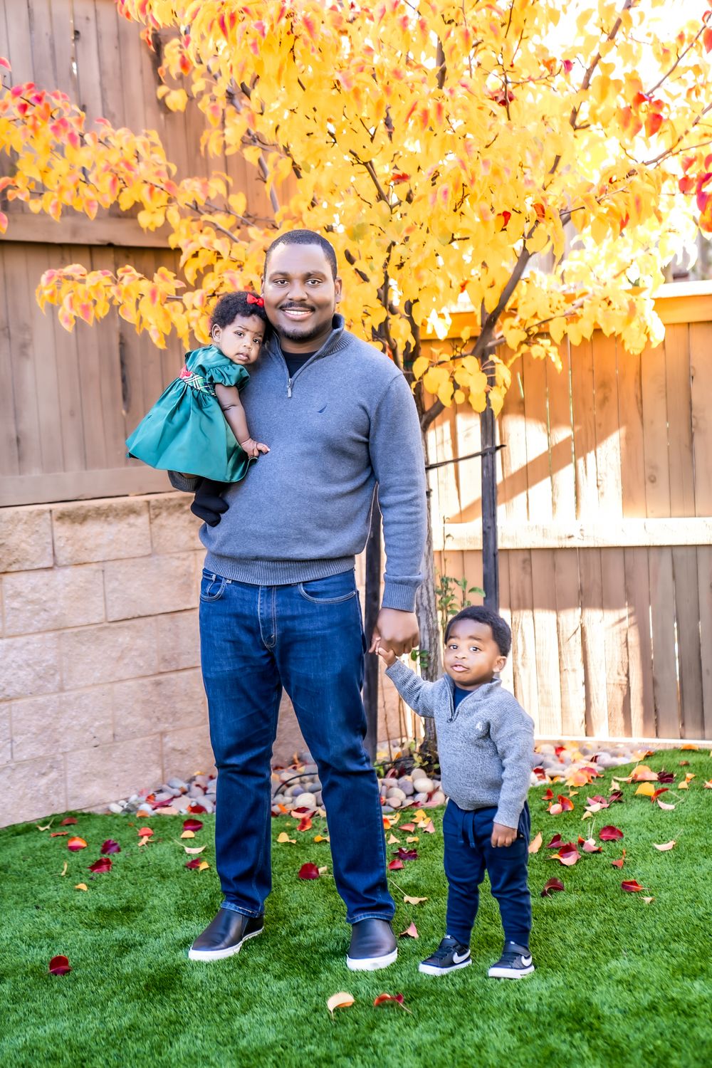 A sequence of autumn photos showing people standing on grass with golden yellow trees and a wooden fence in the background.