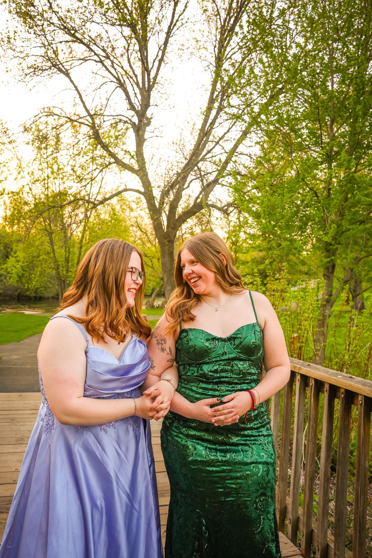 Prom photos in Star Prairie, Wisconsin. Two girls in prom dresses laughing for their prom photos.