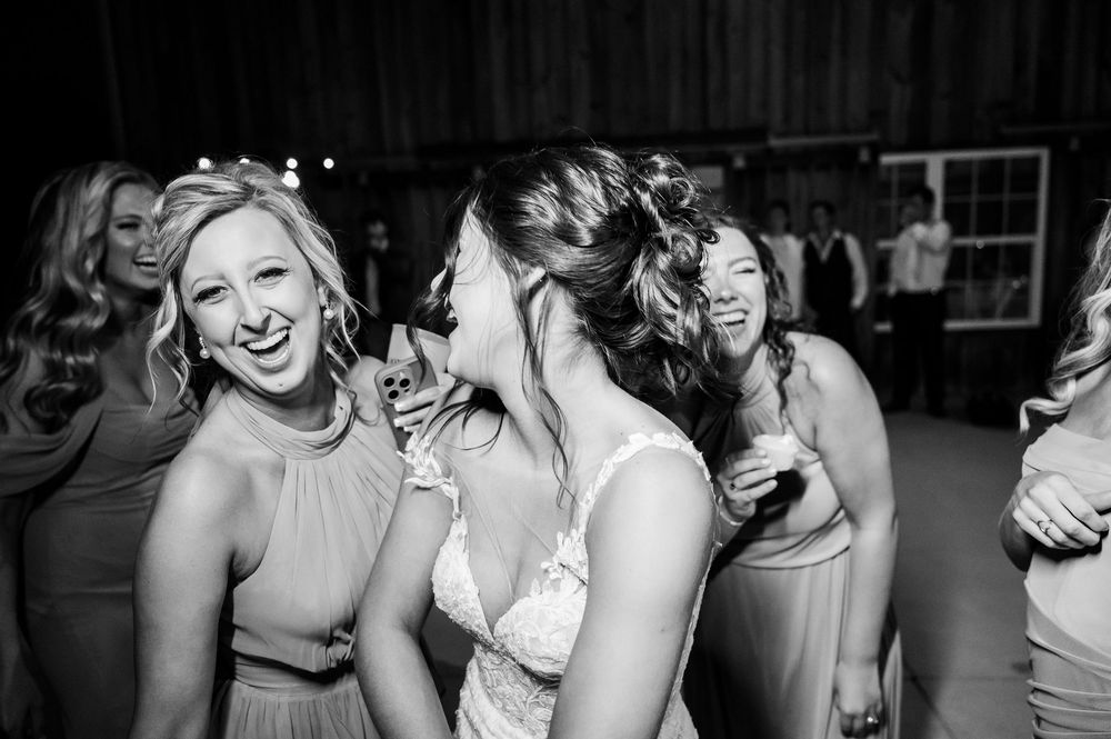 Wedding guests enjoying a fun dance party moment at the reception.
