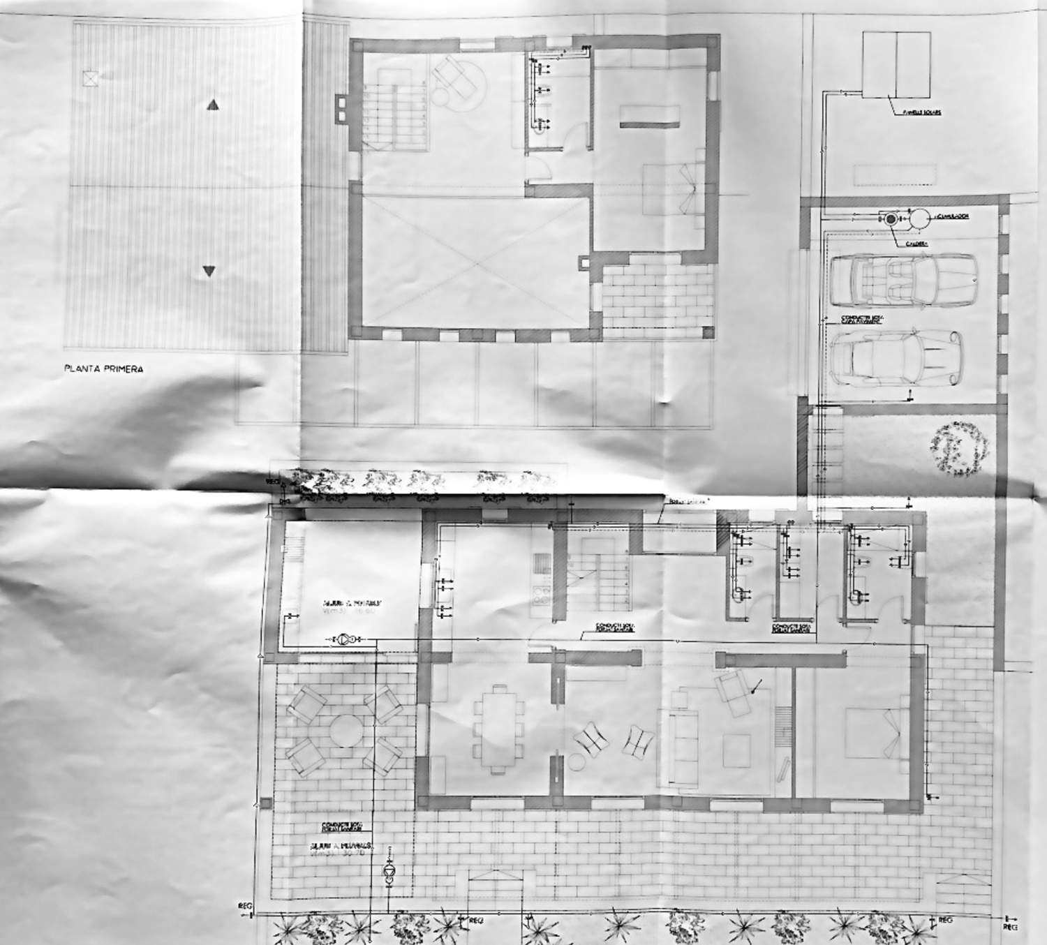 Architectural floor plan blueprint showing detailed layout of a residential home with multiple rooms and garage.