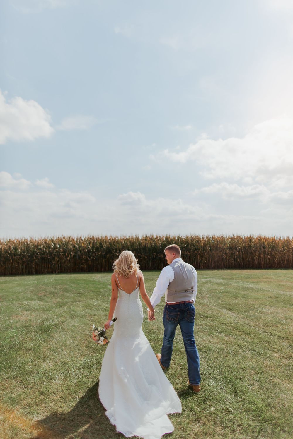 Bride and groom wedding day walking sunset Zionsville, Indiana