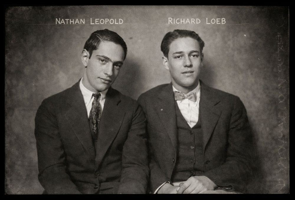 Black and white mugshot photo of Nathan Leopold and Richard Loeb, two young men in suits, 1920s.