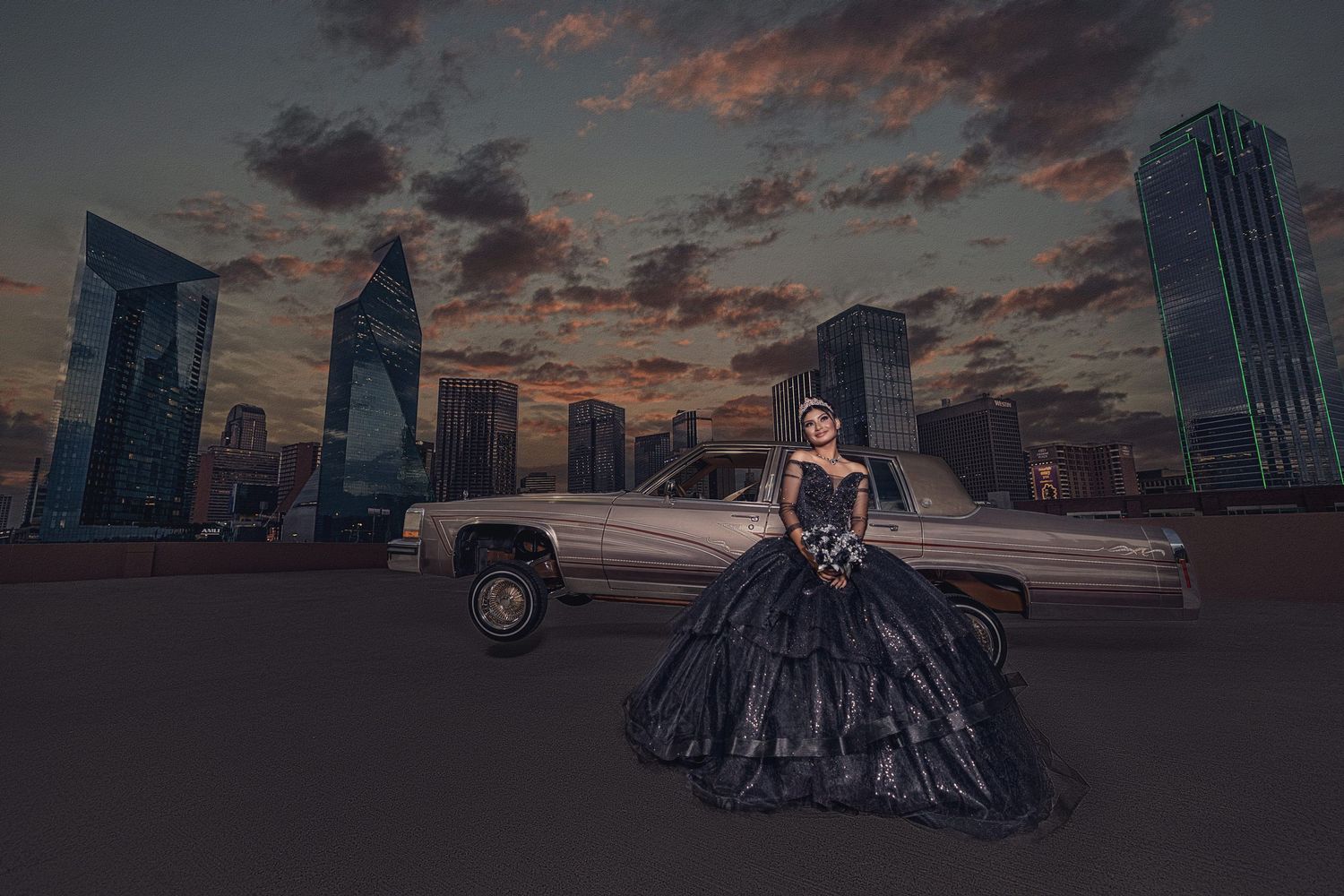 quinceanera in a sparkling black gown posing with a classic lowrider car against the iconic Dallas skyline at twilight.