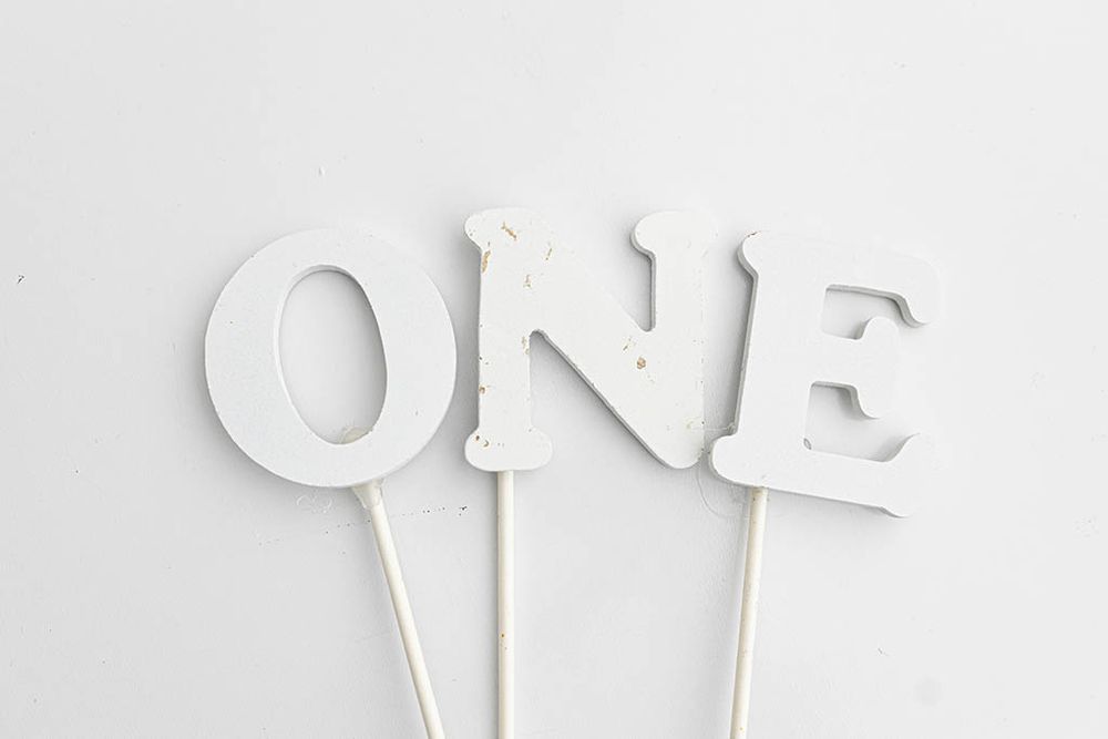 Set of three white wooden letter cake toppers spelling ONE for 1st birthday photographer in Lake Elsinore.