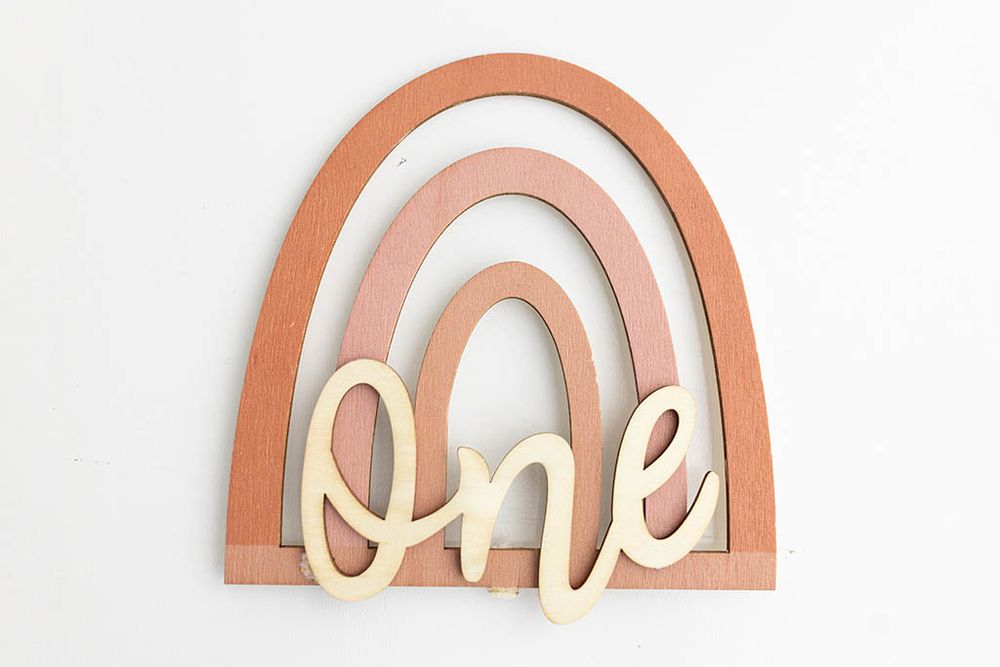 Boho rainbow wooden cake topper for Temecula baby cake smash session.